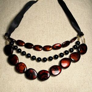 Three strand costume necklace black beads, faux agate, satin ribbon w/ gold tone